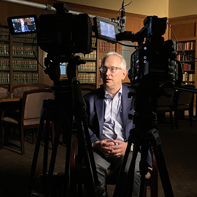 Professor Moreteau speaks at an event in the McKernan Auditorium