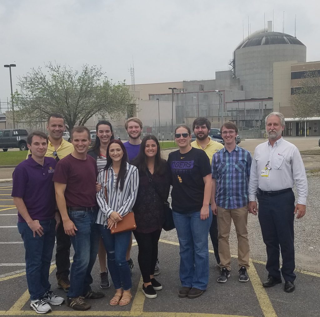 Students pose in front the River bend Nuclear Facility