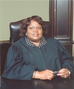 A headshot photo of a woman wearing a judge's robe