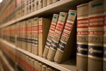 a row of law text books on a shelf