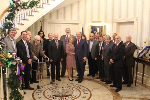 Professor George Pugh at a Feb. 11, 2019, luncheon at the Governor’s Mansion to celebrate the life and career of Judge James “Jim” Brady, who passed away in 2017. Others in attendance included, from left, Frank Holthaus (’75), Chris Zainey, Judge Stan Duval (’66), Judge Shelley D. Dick (’88), Professor Pugh (’50), Magistrate Judge Erin Wilder-Doomes (’99), Bankruptcy Judge Douglas D. Dodd, LSU Law Dean Tom Galligan, LSU Board of Supervisors Member Rémy Voisin Starns, Donna Edwards, Governor John Bel Edwards (’99), Pamela Starns, Richard Ieyoub (’72), Matthew Block, Donald Cazayoux, Magistrate Judge Richard Bourgeois, Judge James L. Dennis (’62), Judge Brian A. Jackson, Judge Jay C. Zainey (’75), and Ed Walters (’75). 