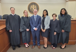 The Hon. Scott D. Johnson (from left to right), LSU Law Interim Dean Lee Ann Wheelis Lockridge, Scott Wheat Jr., Sarah Perkins, the Hon. Triche Milazzo, and the Hon. Erin Wilder-Doomes pose for a photo following the final round of the 2022 Dean’s Cup Moot Court Competition. 