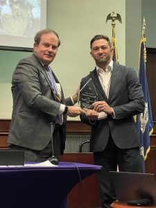 Andrew Martin ('12) accepted the LSU Mineral Law Institute Distinguished Service Award on behalf of his late friend and colleague, Randall "Randy" Davidson ('76) at the 71st Mineral Law Institute on March 21 from LSU Law Professor Keith Hall.