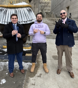 LSU Law second-year students Joshua Silverman, left, and Christian Gallusser, right, pose with 3L and student coach David Gonzalez, center, after winning the 2025 Fordham National Basketball Negotiation Competition Championship in New York City on Jan. 25. 