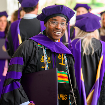 Students celebrating Hats n' Canes on the steps of the Law Center