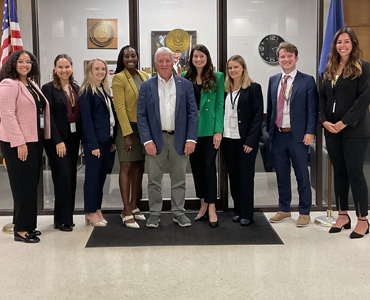 Photo of students gathering at Hillar Moore's office